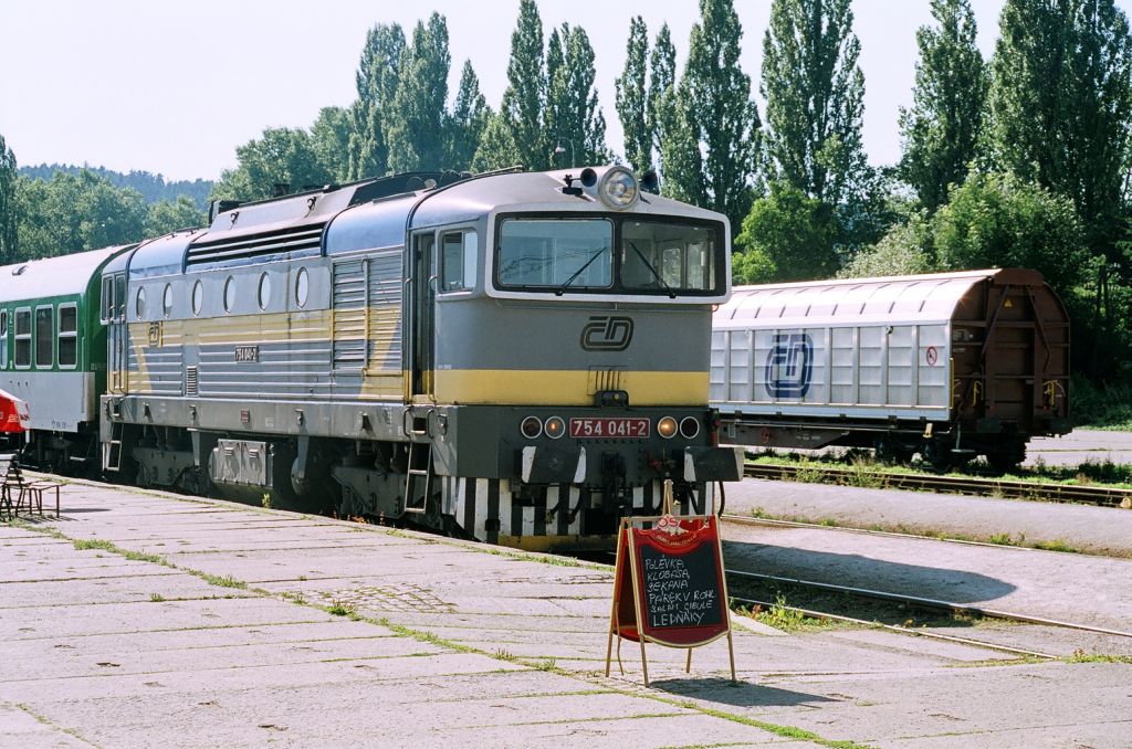 The locomotive with a passenger-train in the Okříšky railway station, July 2006